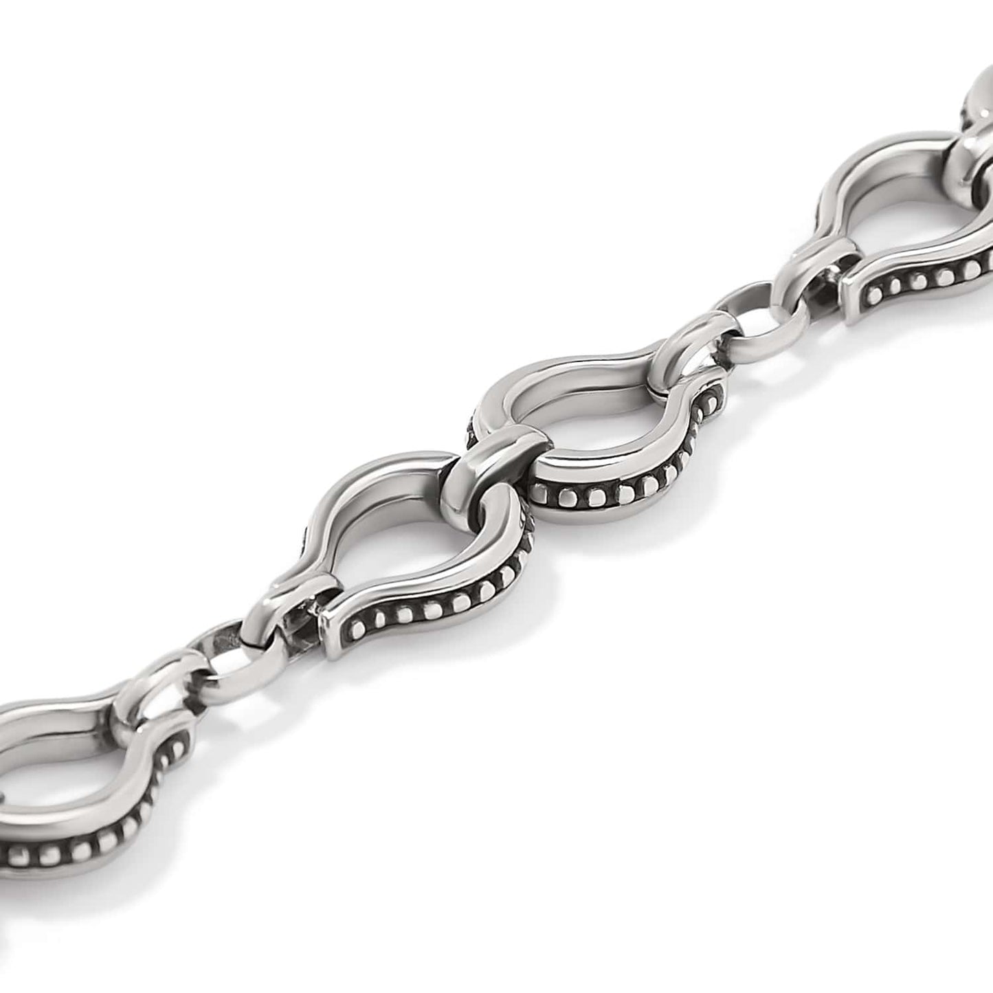 Close-up of Brighton chain with silver-plated horseshoe-shaped links featuring beaded edge detailing and polished finish
