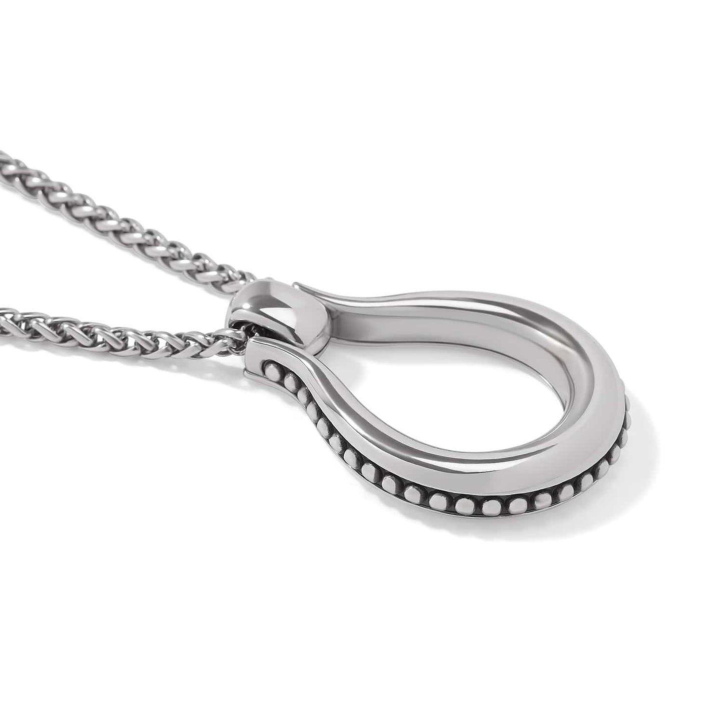 Close-up of Brighton horseshoe pendant necklace with silver-plated finish, beaded edge detail, and woven chain