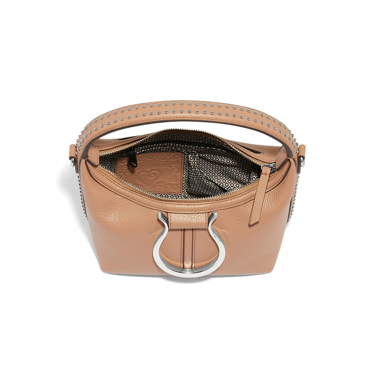 Brighton tan leather handbag shown open with studded top handle, patterned interior lining, and silver-tone ring hardware on a white background