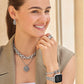 Model wearing Brighton silver-plated beaded hoop earrings with layered chain necklace, pendant, ring, and watch bracelet