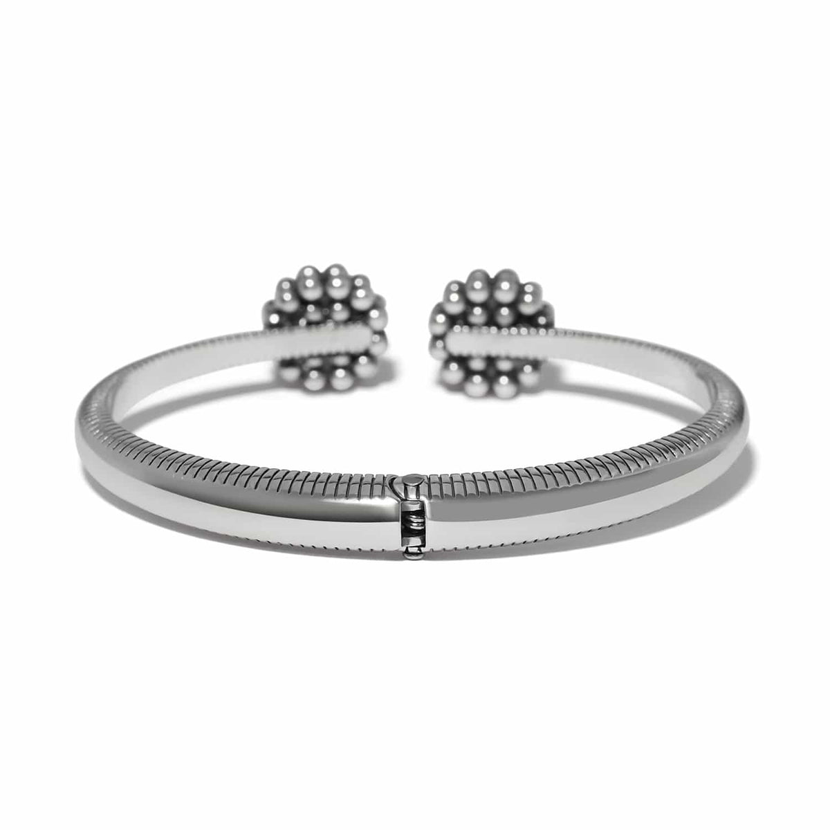 Brighton hinged cuff bracelet with silver-plated finish, ribbed texture, and beaded floral end caps on a white background