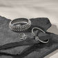 Brighton silver-plated beaded bangle bracelet and cuff bracelets styled with dark slate stones on a neutral background