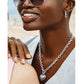 Model wearing a Brighton silver-plated chain necklace with heart pendant paired with coordinating silver-plated hoop earrings