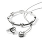 Brighton silver-plated jewelry set styled with heart-motif bangle, ring, and pendant necklace on a white background