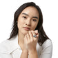 Model wearing a Brighton silver-plated heart ring paired with matching silver-plated stud earrings