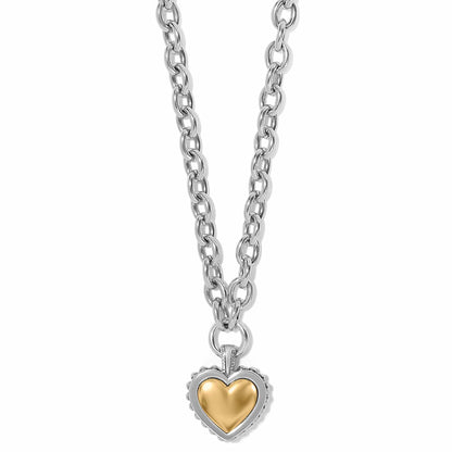 Brighton pendant necklace with two-tone silver chain and gold heart charm in beaded silver frame on a white background