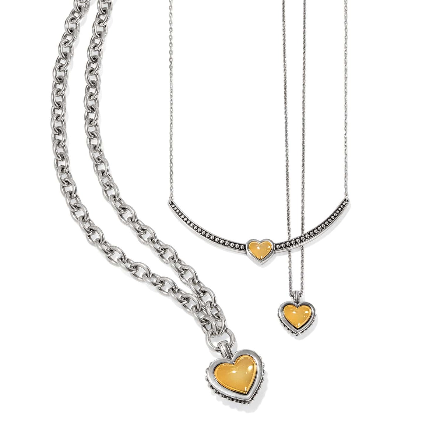 Brighton necklaces with two-tone heart pendants and silver-tone chains in varying link sizes on a white background