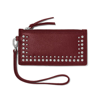 Brighton burgundy leather wristlet wallet with silver-tone studs, zipper closure, and detachable wrist strap on a white background