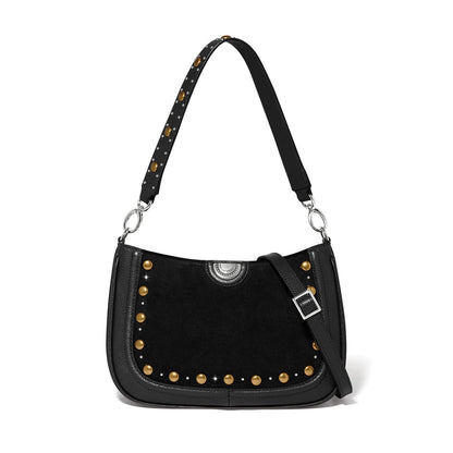 Brighton black suede shoulder handbag with gold studs, silver medallion, and studded leather strap on a white background