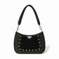 Brighton black leather shoulder handbag with gold-tone studs, suede panel, and braided strap on a white background