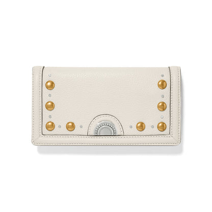 Brighton wallet in cream leather with gold-tone studs, crystal accents, and silver-tone medallion clasp on a white background