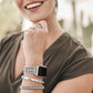 Model wearing a Brighton silver-plated beaded Apple watch band with coordinating Brighton bangles, ring, and hoop earrings