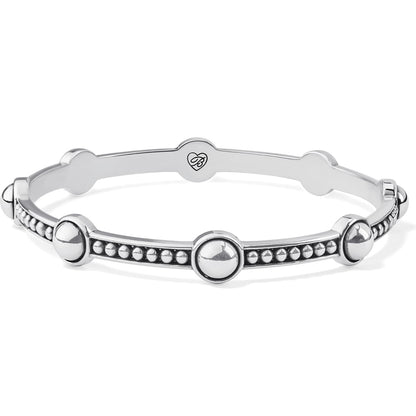 Brighton silver-plated bangle bracelet with polished round dome stations and beaded detailing between them on a white background