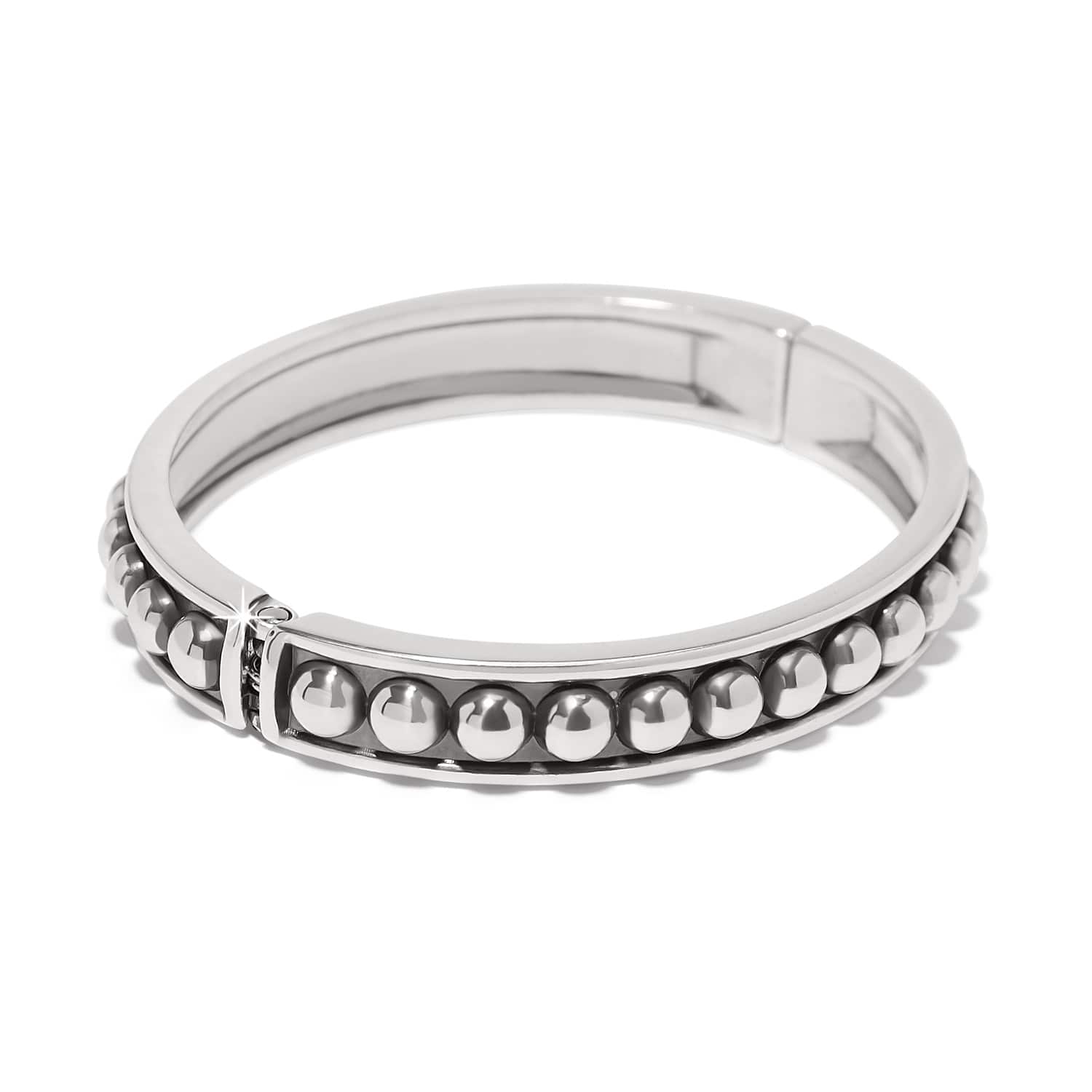 Brighton hinged bangle bracelet with silver-plated beaded row detail and polished band on a white background