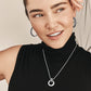 Model wearing Brighton silver-plated beaded hoop earrings paired with a silver-plated pendant necklace with crystal accents