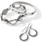 Brighton silver-plated jewelry set styled with linked bracelet, studded bangle, and beaded teardrop earrings on a white background