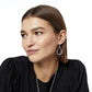Model wearing a Brighton silver-plated teardrop drop earring with crystal accents along the inner curve