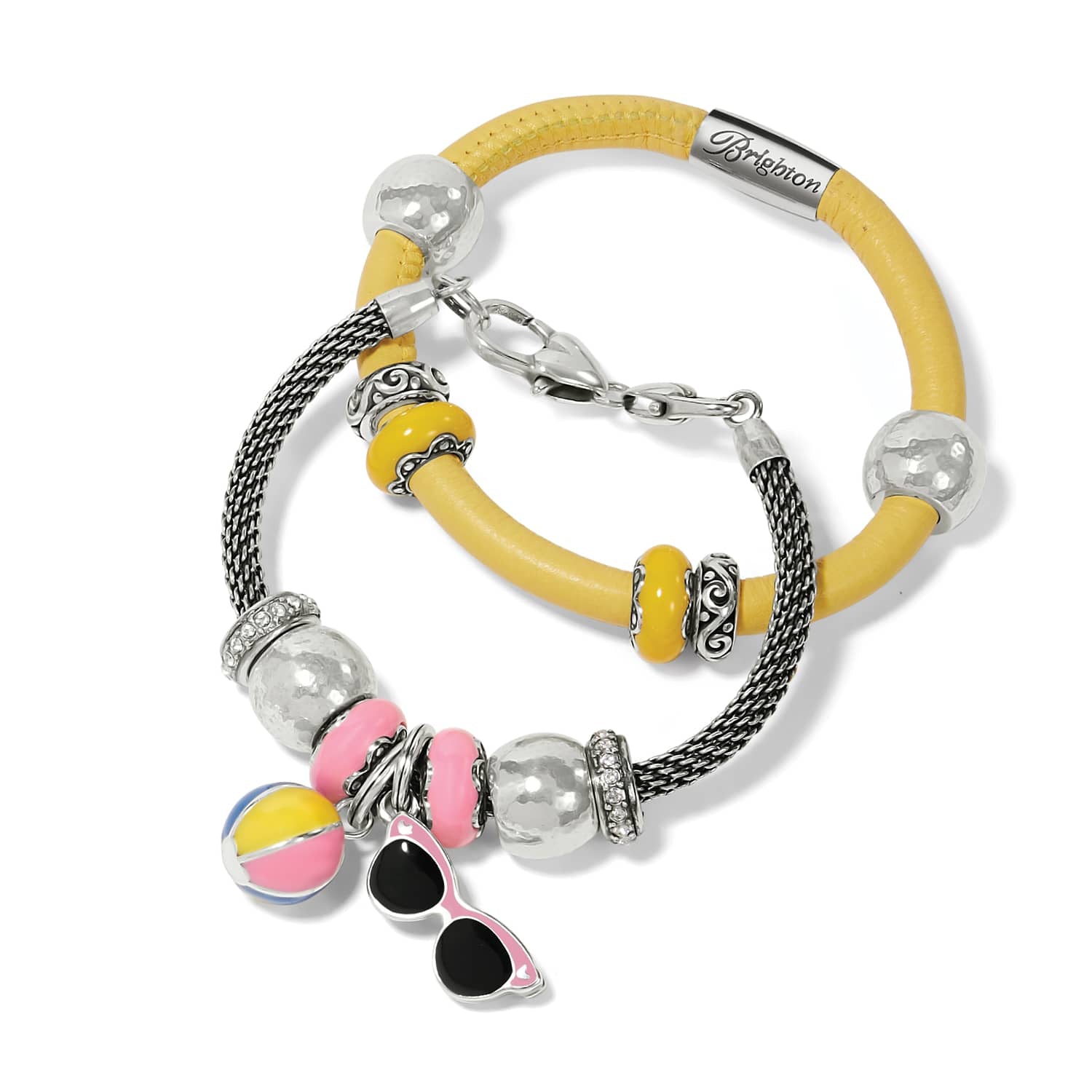 Brighton charm bracelets in yellow leather and silver-tone mesh with beach ball and sunglasses charms on a white background