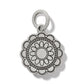 Brighton silver-plated charm with scalloped edge and engraved floral medallion design on a white background