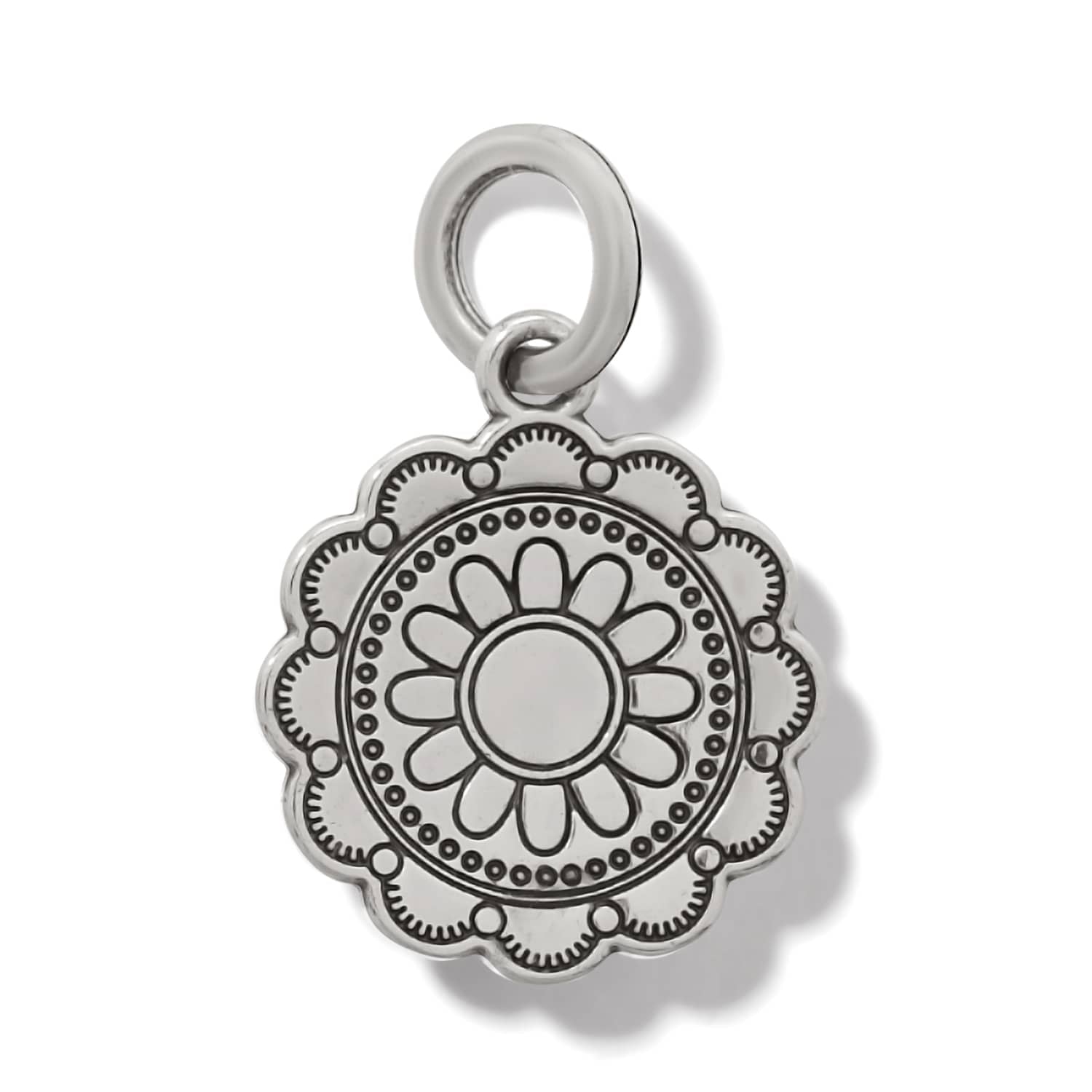Brighton silver-plated charm with scalloped edge and engraved floral medallion design on a white background