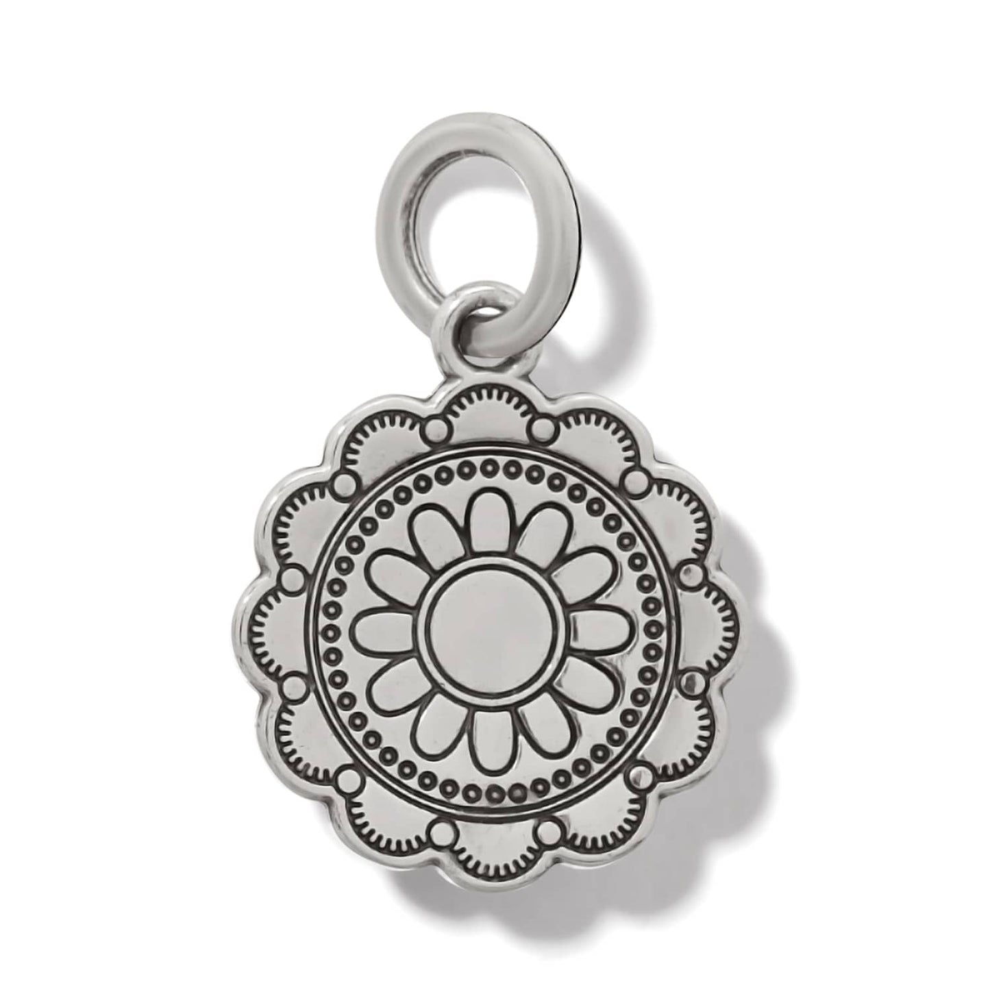 Brighton silver-plated charm with scalloped edge and engraved floral medallion design on a white background