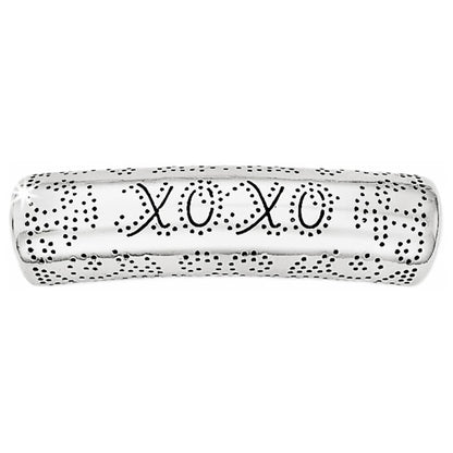 Brighton silver-plated ring band with engraved XOXO lettering and dotted texture detailing on a white background