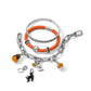 Brighton bracelets styled with silver-plated Halloween charms including pumpkins, black cat, and crystal accents on white background