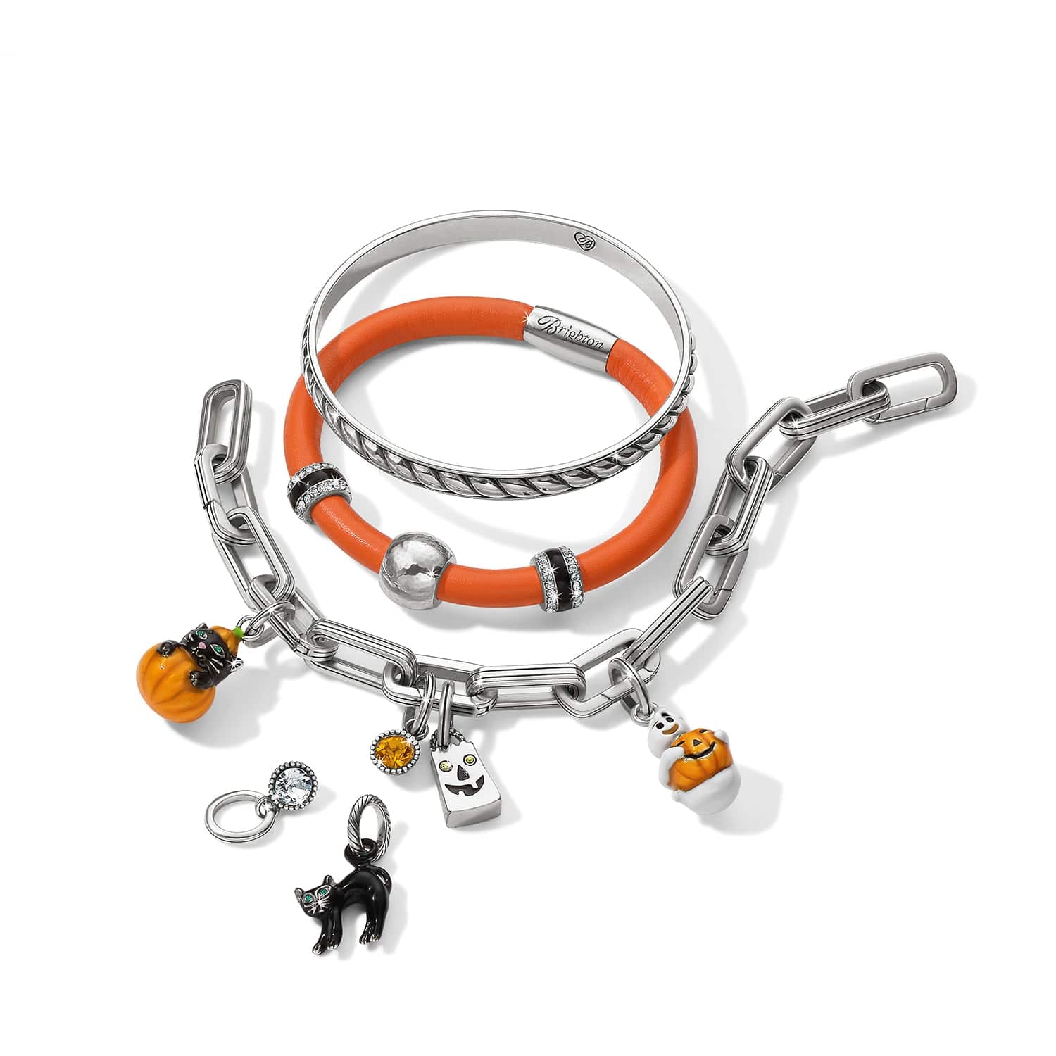 Brighton bracelets styled with silver-plated Halloween charms including pumpkins, black cat, and crystal accents on white background