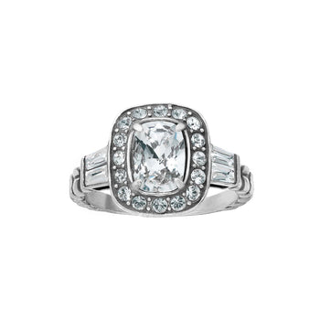 Brighton silver-plated ring with cushion-cut crystal center, halo of small crystals, and baguette side stones on a white background
