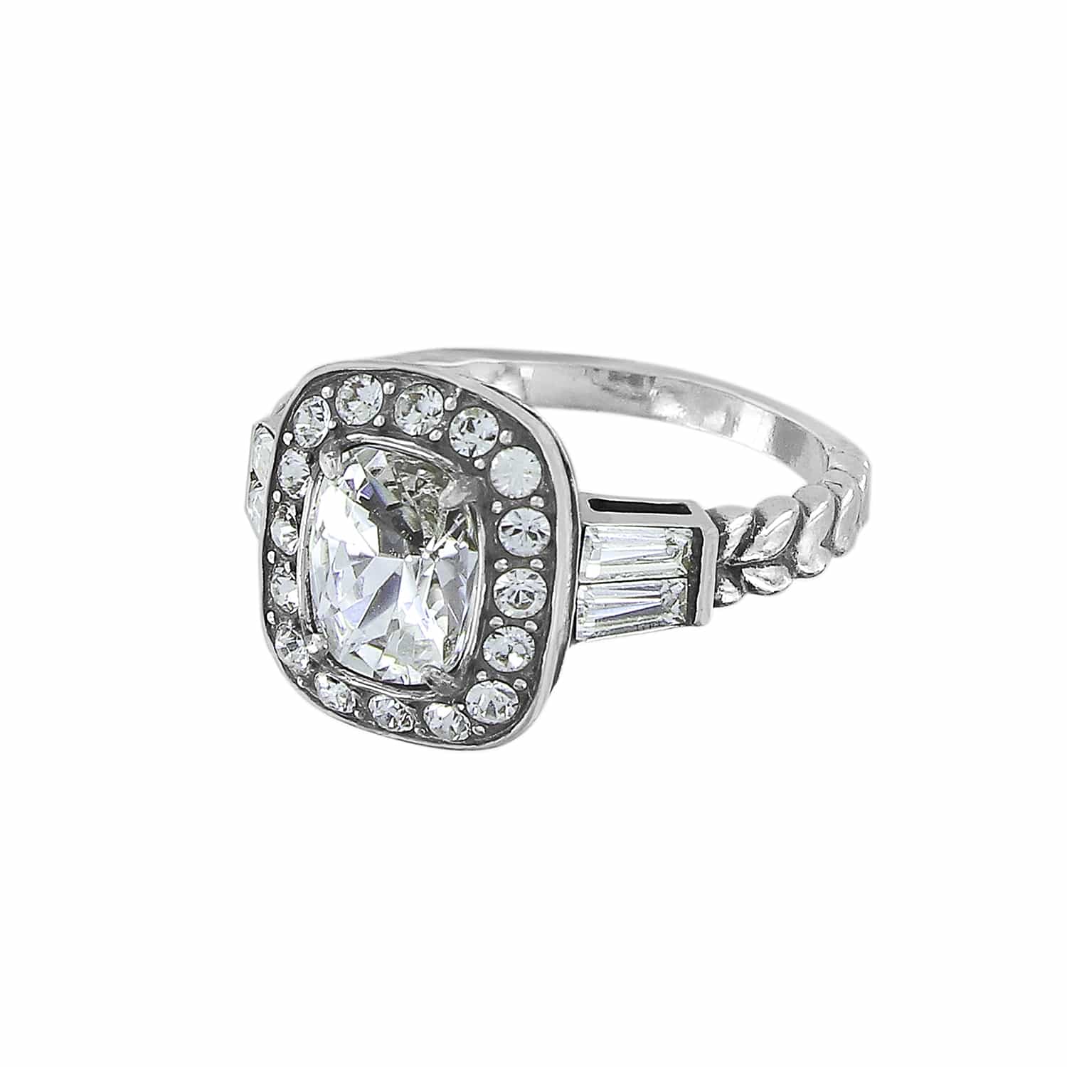 Brighton ring with cushion-cut crystal center, silver-plated halo setting, and baguette side stones on a white background