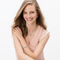 Model wearing Brighton silver-plated crystal drop earrings with coordinating Brighton pendant necklace, bracelet, and ring accessories