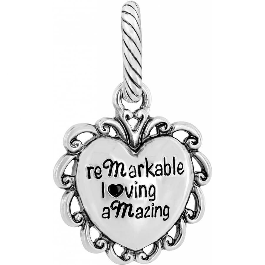 Brighton heart charm with silver-plated scrollwork frame and engraved words remarkable loving amazing on a white background