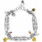 Brighton charm bracelet with silver-plated inscribed plaques, brushed gold heart and flower charms, and crystal beads on a white background