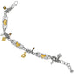 Brighton charm bracelet with silver-plated heart stations, brushed gold hearts, crystal accents, and dangling charms on a white background