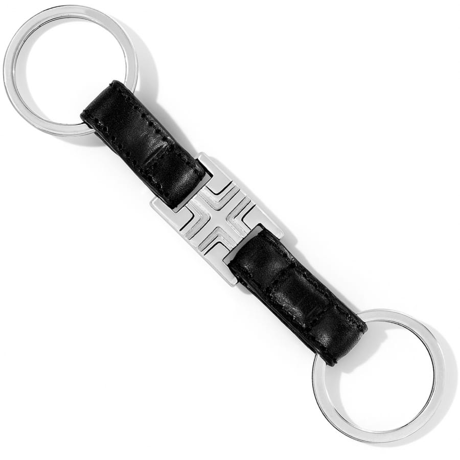 Brighton key fob with dual silver-tone split rings and black leather straps with center emblem on a white background