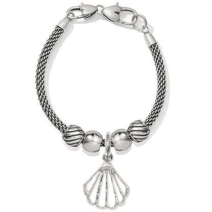 Brighton charm bracelet with silver-plated mesh chain, beaded accents, and openwork seashell charm on a white background