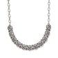 Brighton silver-plated necklace with row of ornate medallion links featuring heart cutout details on a white background