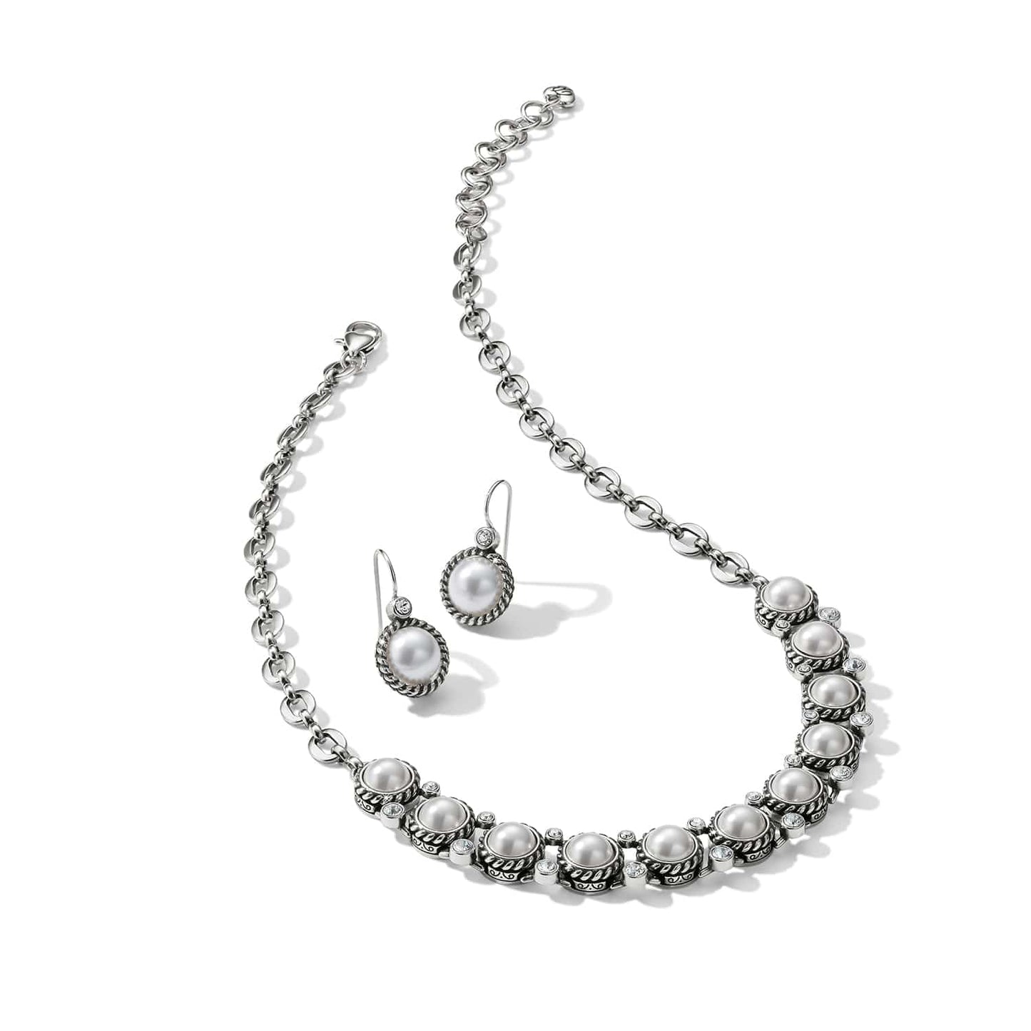 Brighton silver-plated necklace and drop earrings set with glass pearls and crystal accents on a white background