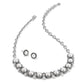Brighton silver-plated necklace and stud earrings set with glass pearls and crystal accents on a white background