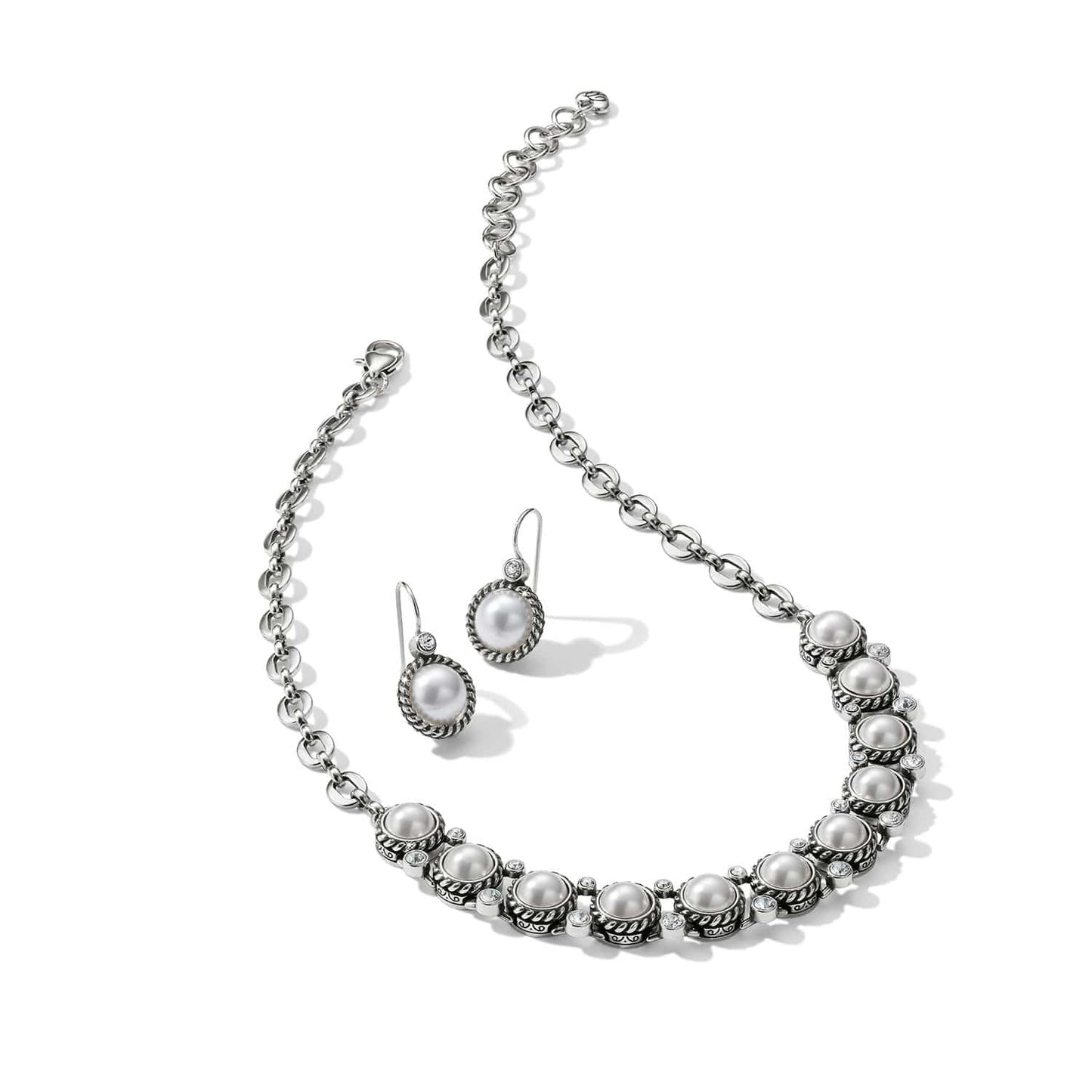 Brighton silver-plated necklace and drop earrings set with glass pearls and crystal accents on a white background