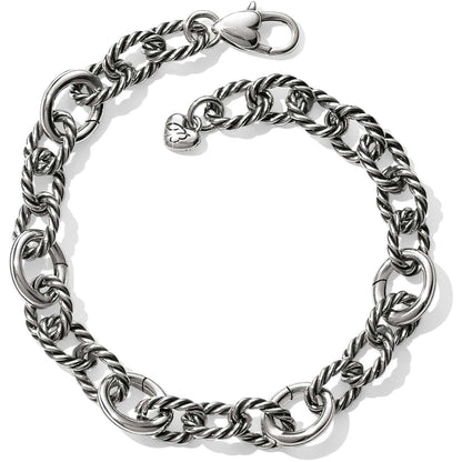 Brighton silver-plated link bracelet with twisted rope oval links, lobster clasp, and heart charm on a white background
