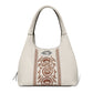 Brighton handbag in cream leather with brown embroidered scrollwork and silver-tone knot accent on a white background