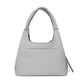Brighton gray pebbled leather handbag shown from the back with single top handle and slim pocket on a white background