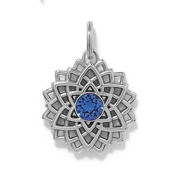 Brighton silver-plated lotus charm with blue crystal center and layered openwork petal design on a white background
