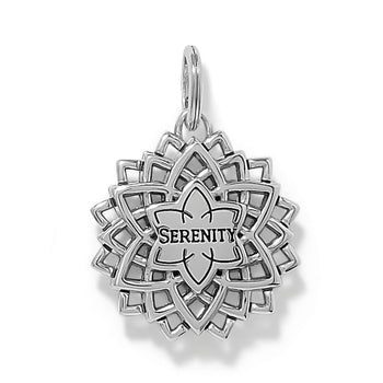 Brighton lotus charm with silver-plated openwork petals and engraved Serenity center medallion on a white background