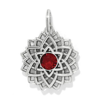Brighton charm with silver-plated lotus design and red faceted crystal center on a white background