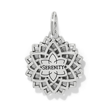 Brighton silver-plated lotus charm shown from the back with engraved Serenity inscription on a white background