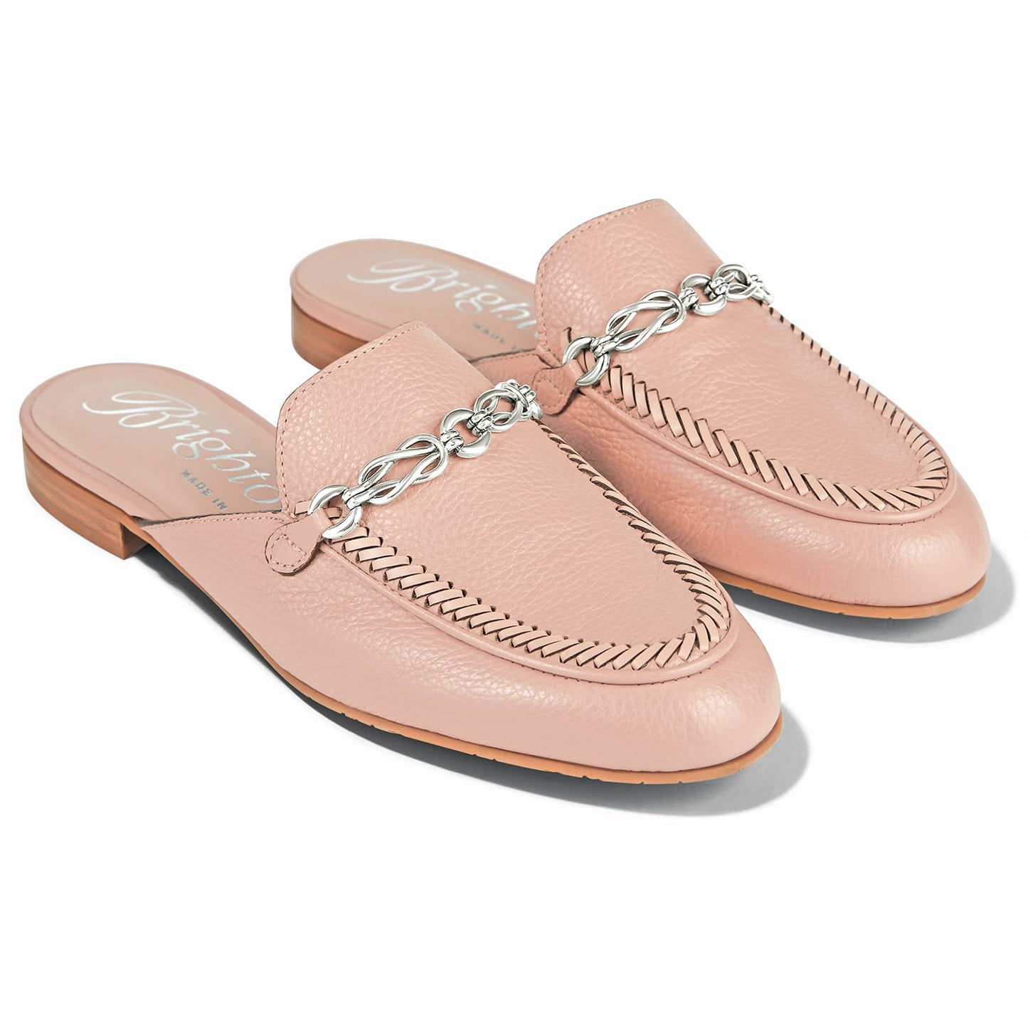 Brighton pink leather mule loafers with silver-tone chain detail and woven leather trim on a white background