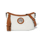 Brighton crossbody handbag in white with tan leather trim, tassel, and silver-tone medallion on a white background