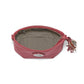 Brighton red leather handbag shown open with patterned fabric lining, tassel zipper pull, and silver medallion on a white background